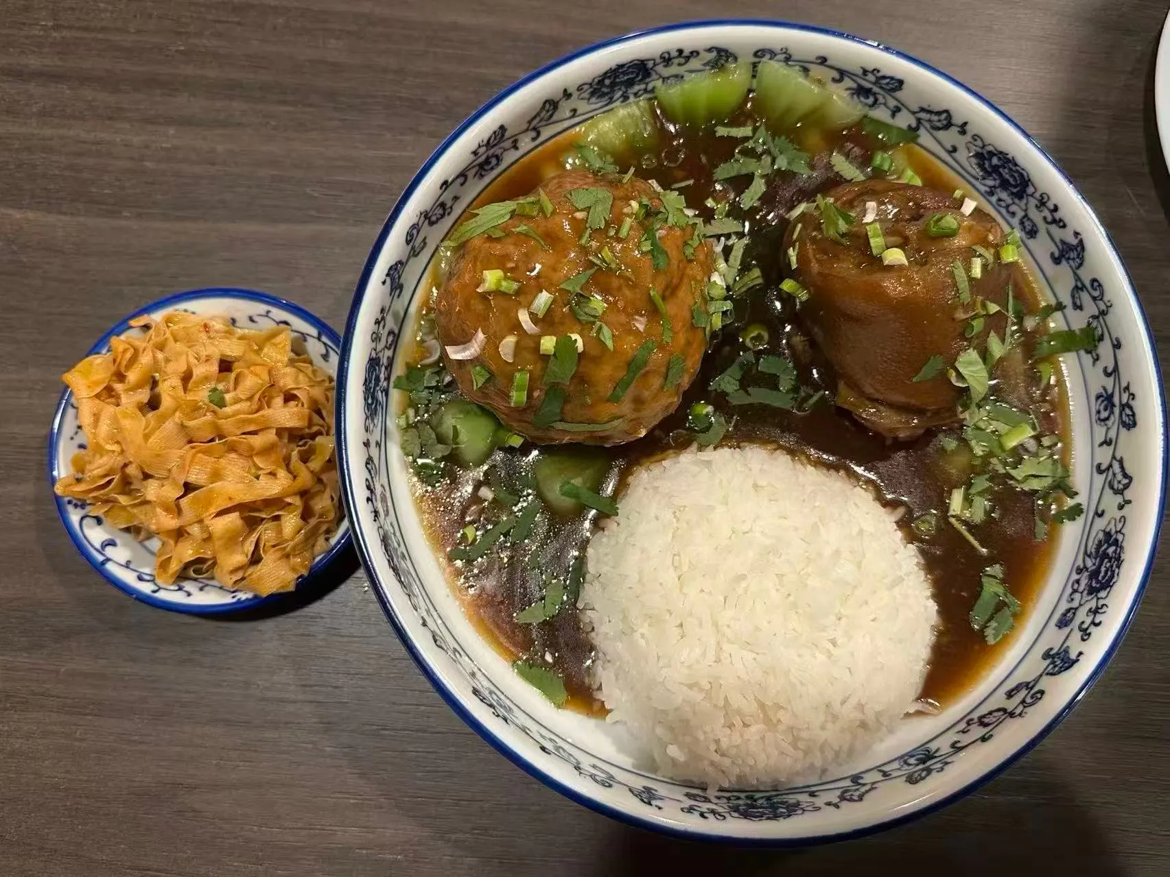 Braised lion meatball rice bowl with braised pork and pickled tofu side dish at 面滋味 Tasty Noodle House, a Chinese Restaurant in Plano