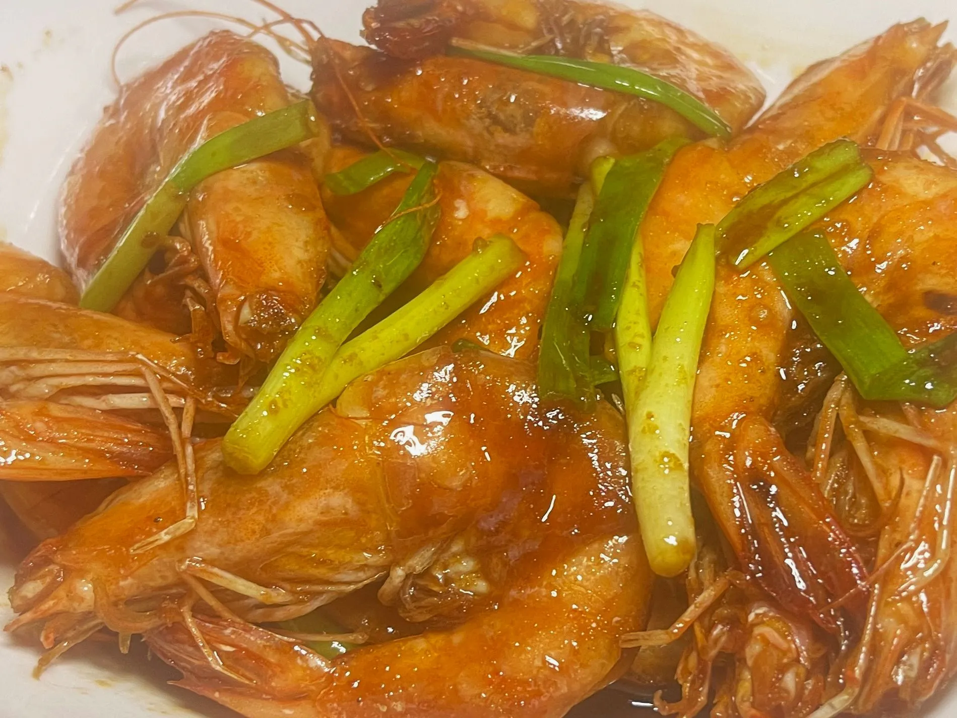 Glazed braised whole prawns garnished with fresh green scallion stalks at 面滋味 Tasty Noodle House, a Chinese Restaurant in Plano Glazed braised whole prawns garnished with fresh green scallion stalks at 面滋味 Tasty Noodle House, a Chinese Restaurant in Plano